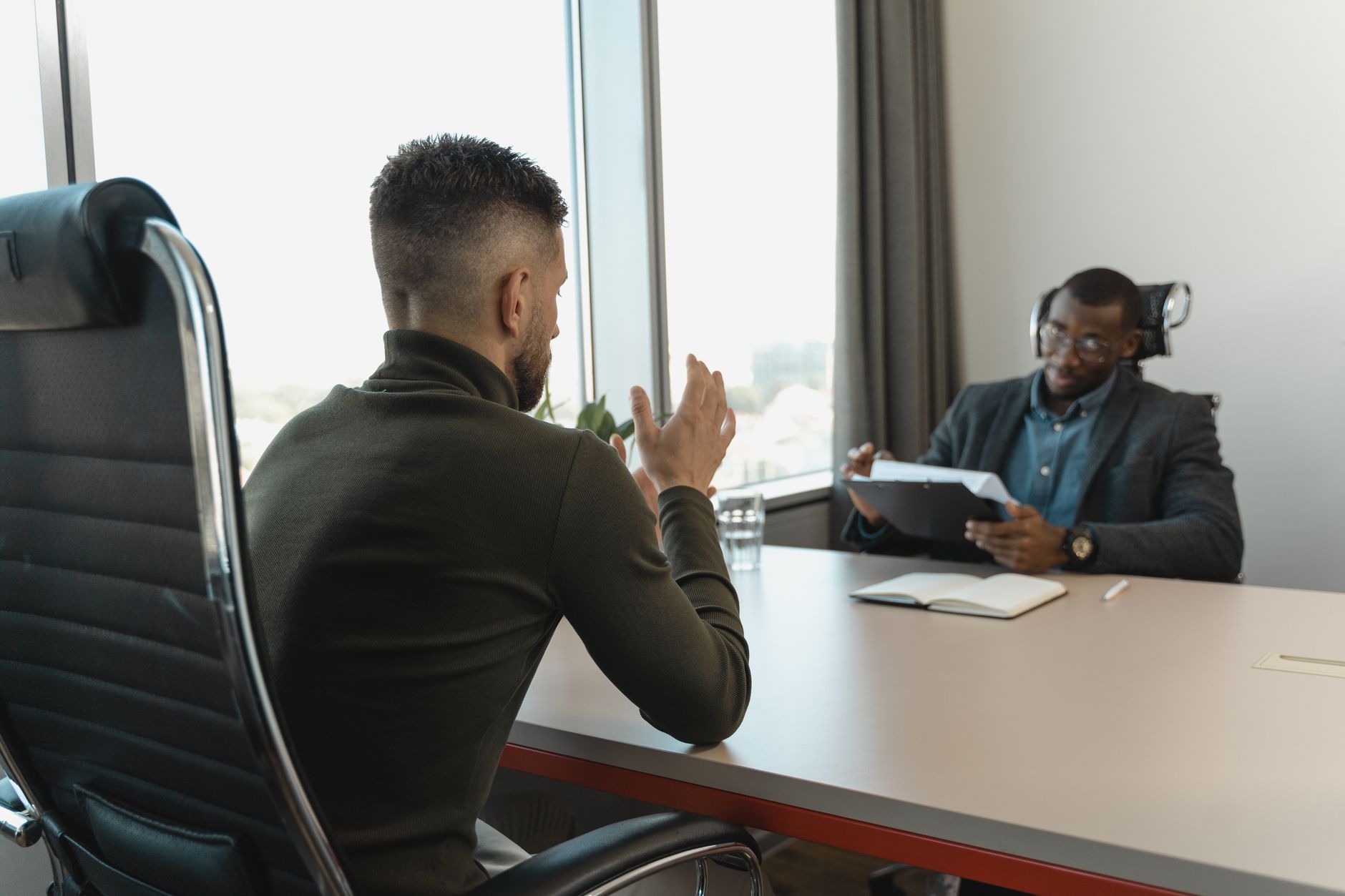 entrepreneur interviewing job candidate office